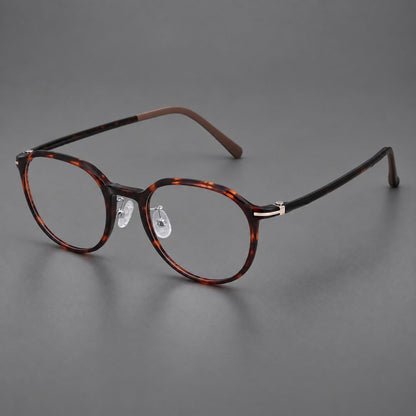 Retro round plastic eyeglasses with a curved bridge and slim metal corner accents in Tortoiseshell, three quarter view additional product view