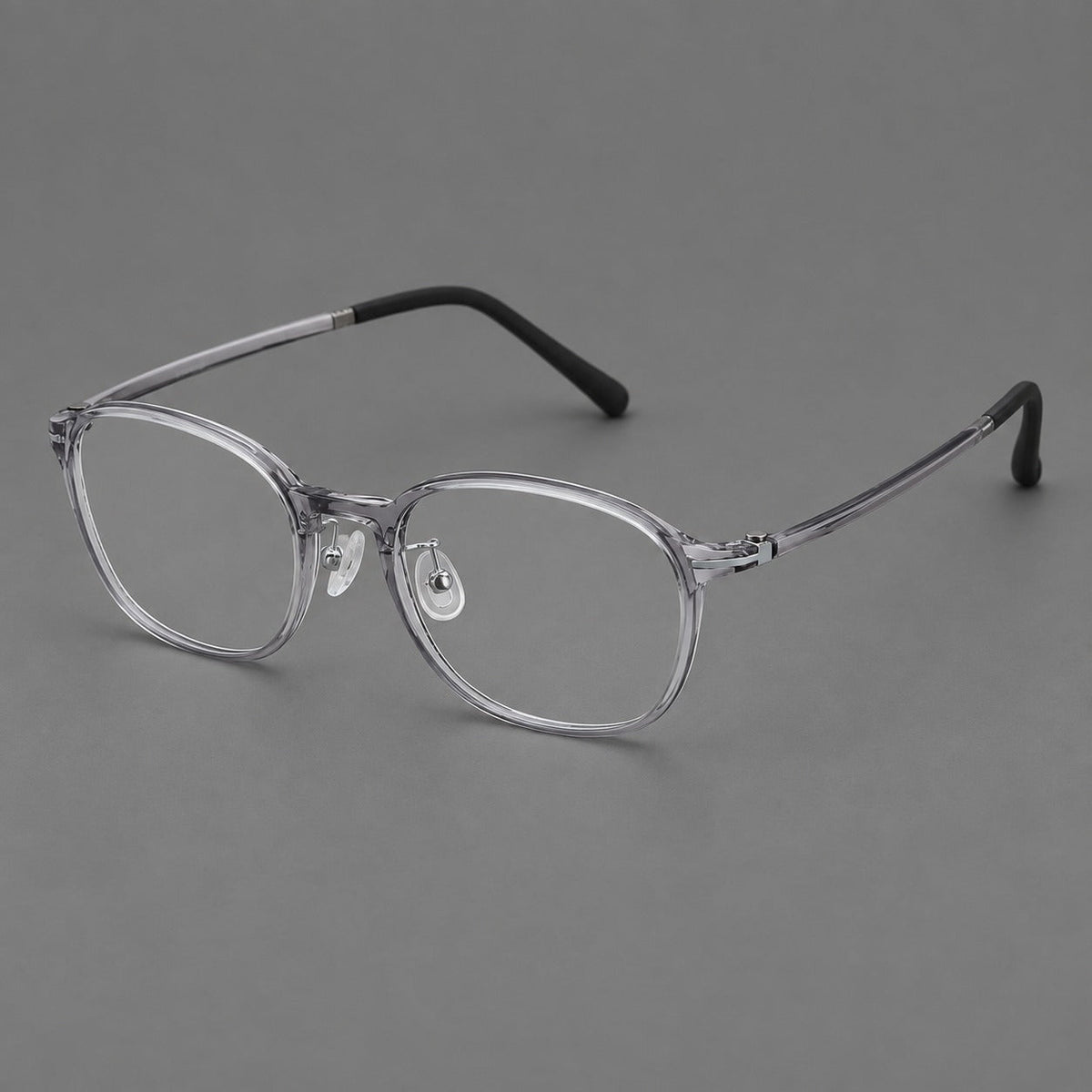 Soft square plastic eyeglasses with a raised browline and rounded lower corners in Clear Gray, three quarter view