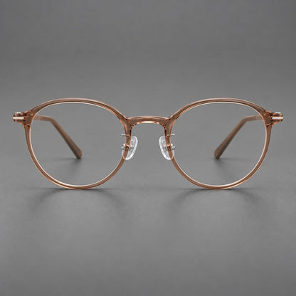 Compact round plastic eyeglasses with gently lifted corners and clear nose pads in Amber Tea, front view temple detail