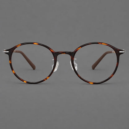 Compact round plastic eyeglasses with gently lifted corners and clear nose pads in Tortoiseshell, front view additional product view