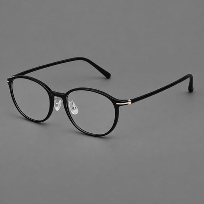Slim oval plastic eyeglasses with a low profile and subtle metal corner accents in Glossy Black, three quarter view