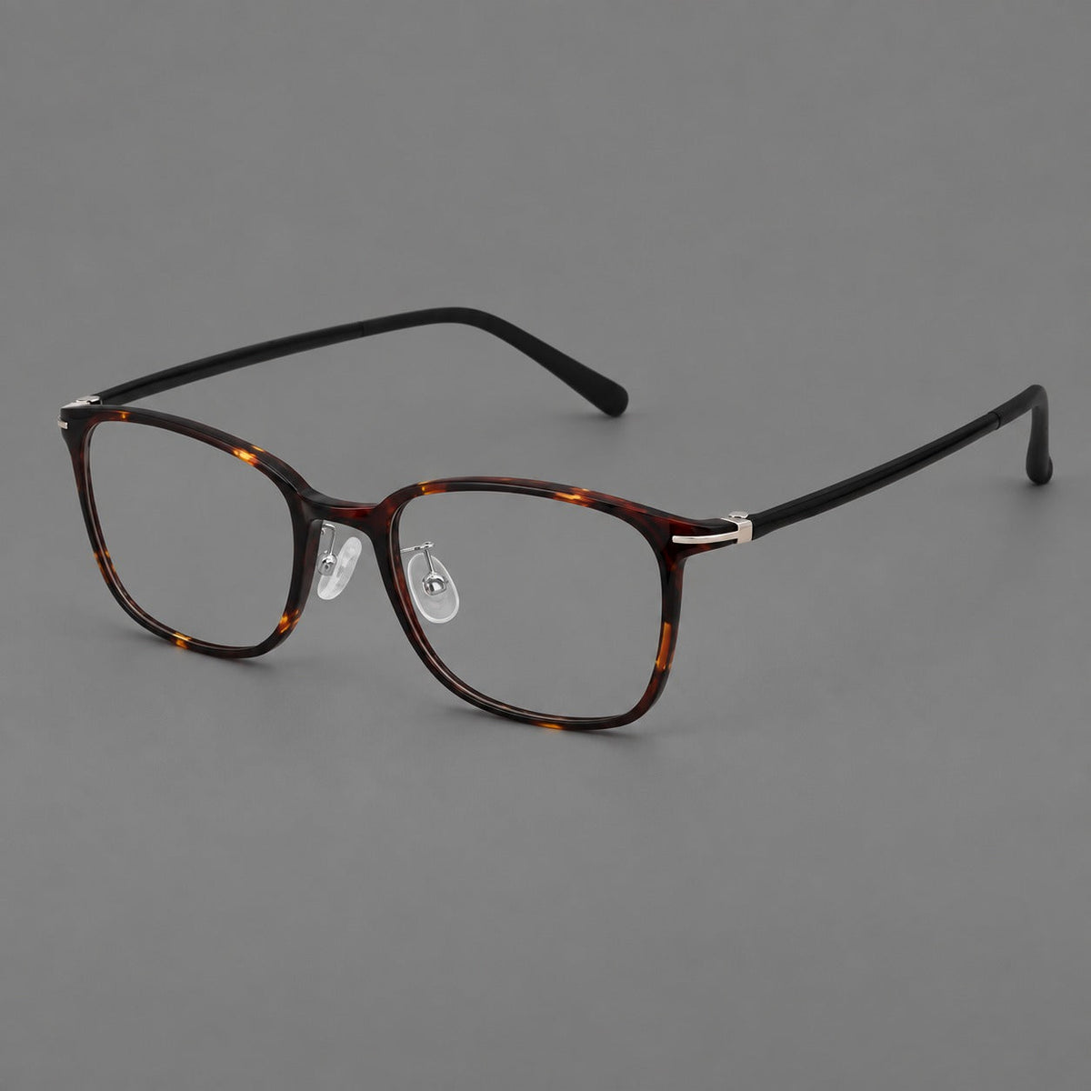Classic square plastic eyeglasses with broad lenses and softly rounded edges in Tortoiseshell, three quarter view