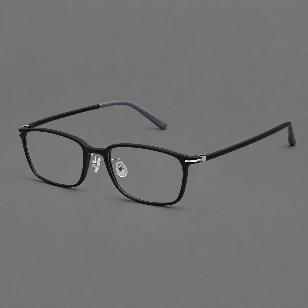 Low profile rectangular plastic eyeglasses with a straight browline and slim temples in Matte Black, three quarter view