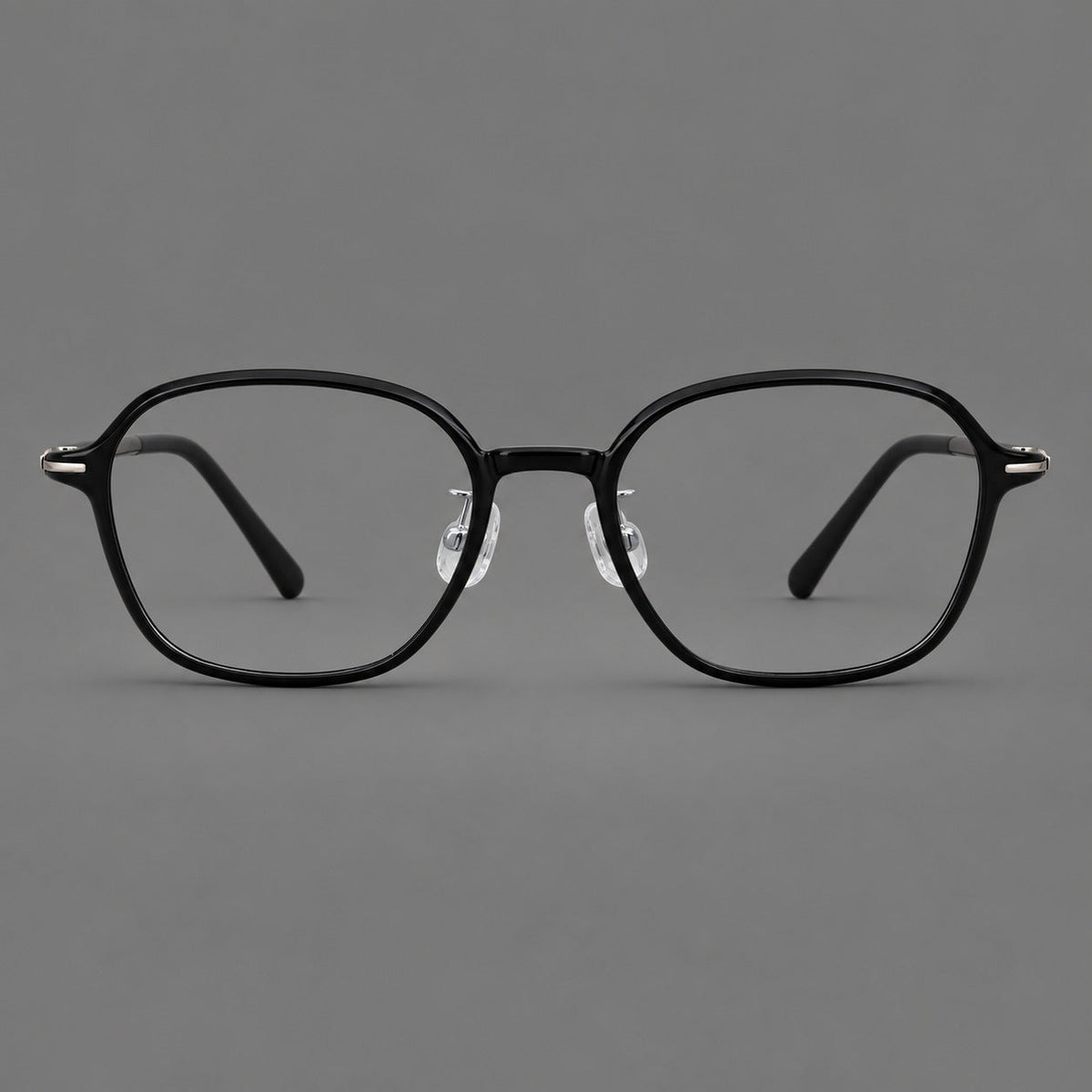 Rounded geometric plastic eyeglasses with softly angled rims and a curved bridge in Glossy Black, front view