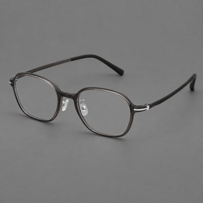 Rounded geometric plastic eyeglasses with softly angled rims and a curved bridge in Dark Gray, three quarter view front view