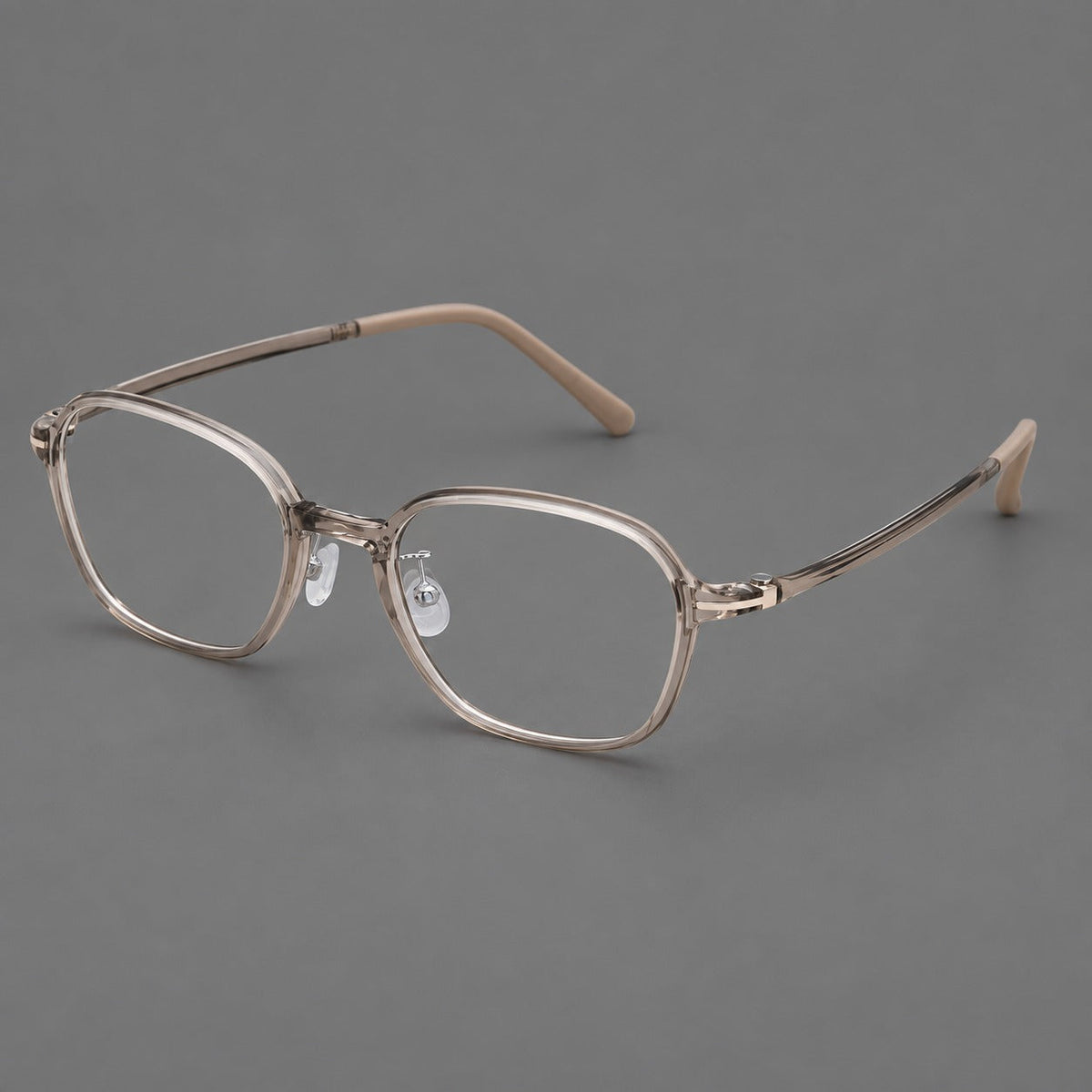 Rounded geometric plastic eyeglasses with softly angled rims and a curved bridge in Twilight Gray Tea, three quarter view