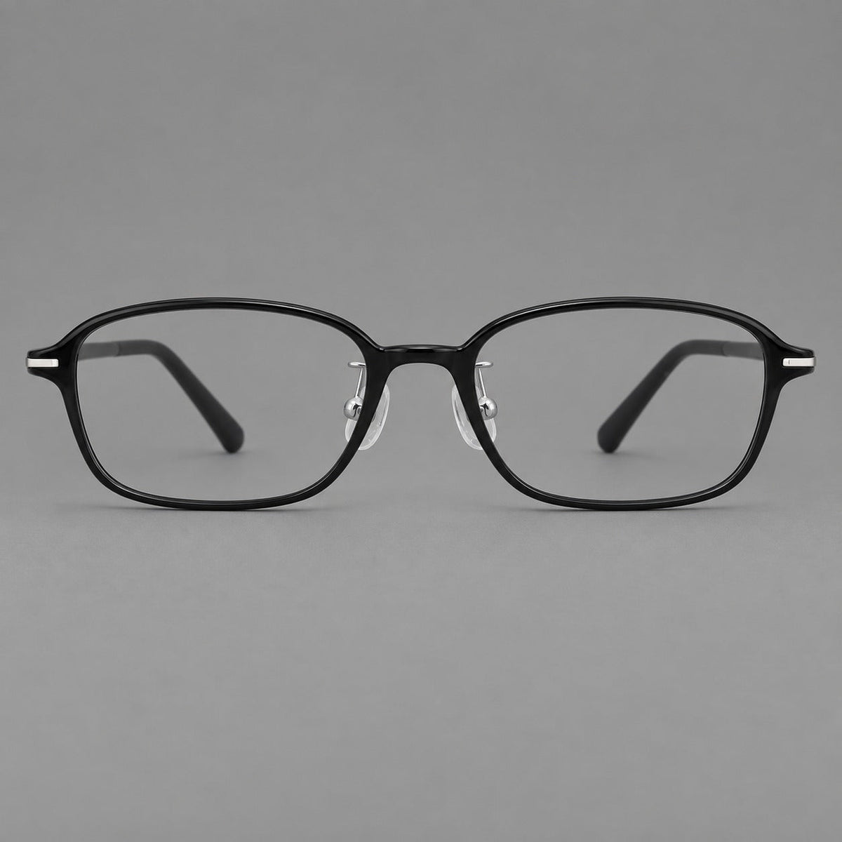 Soft oval plastic eyeglasses with a narrow bridge and gently rounded outer corners in Glossy Black, front view
