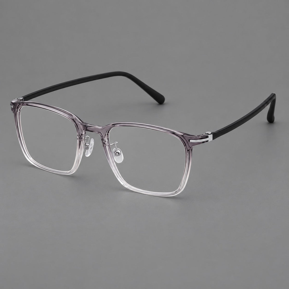 Modern square plastic eyeglasses with a smooth browline and slim metal corner details in Ink Gray Gradient, three quarter view