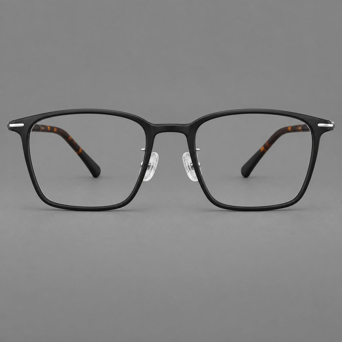 Modern square plastic eyeglasses with a smooth browline and slim metal corner details in Matte Black, front view