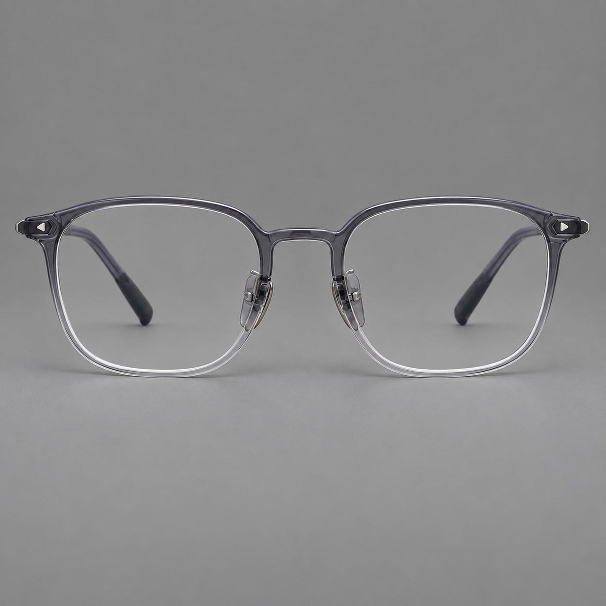 Retro square plastic eyeglasses with a curved bridge and triangular corner details in Ink Gray, front view
