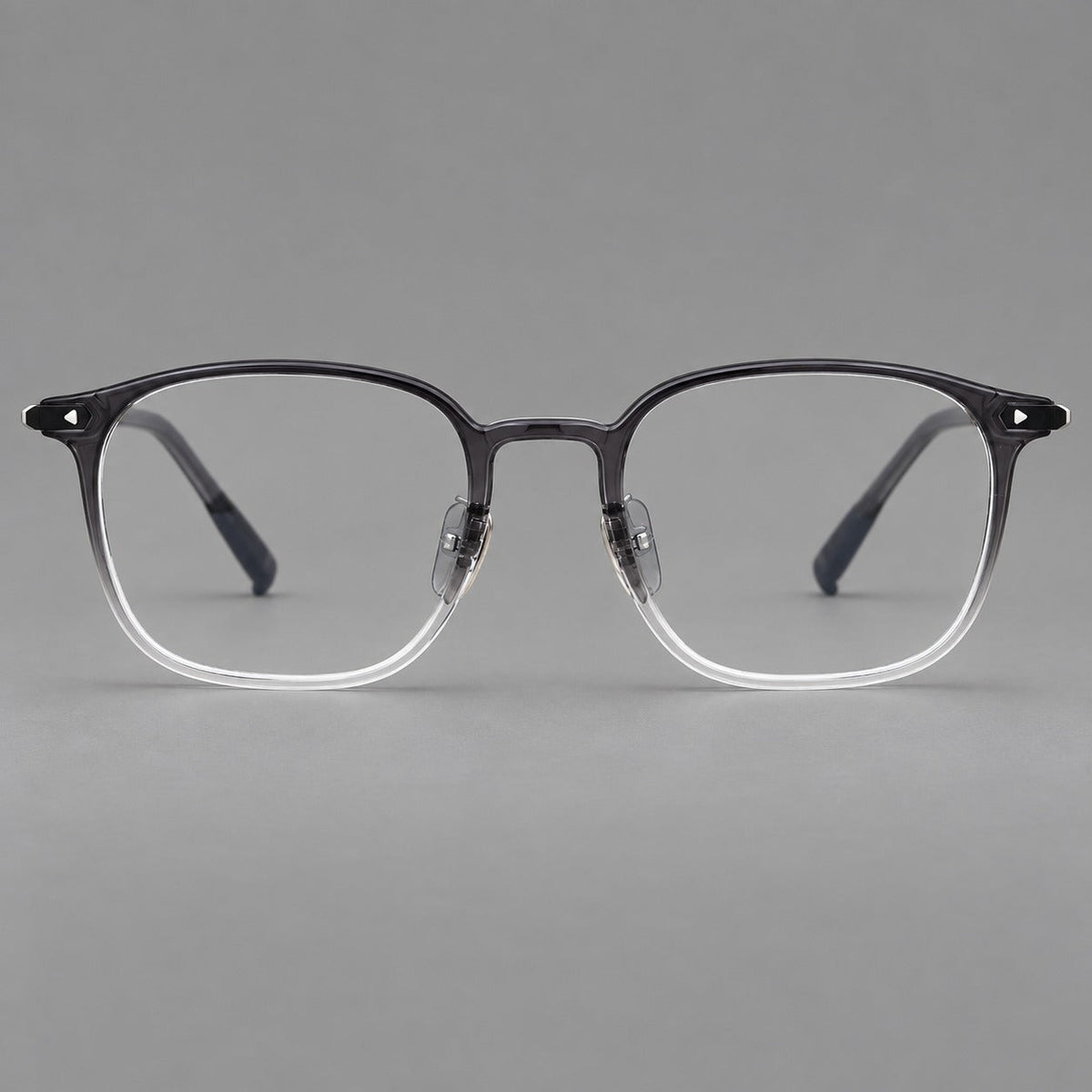 Retro square plastic eyeglasses with a curved bridge and triangular corner details in Ink Gray Gradient, front view