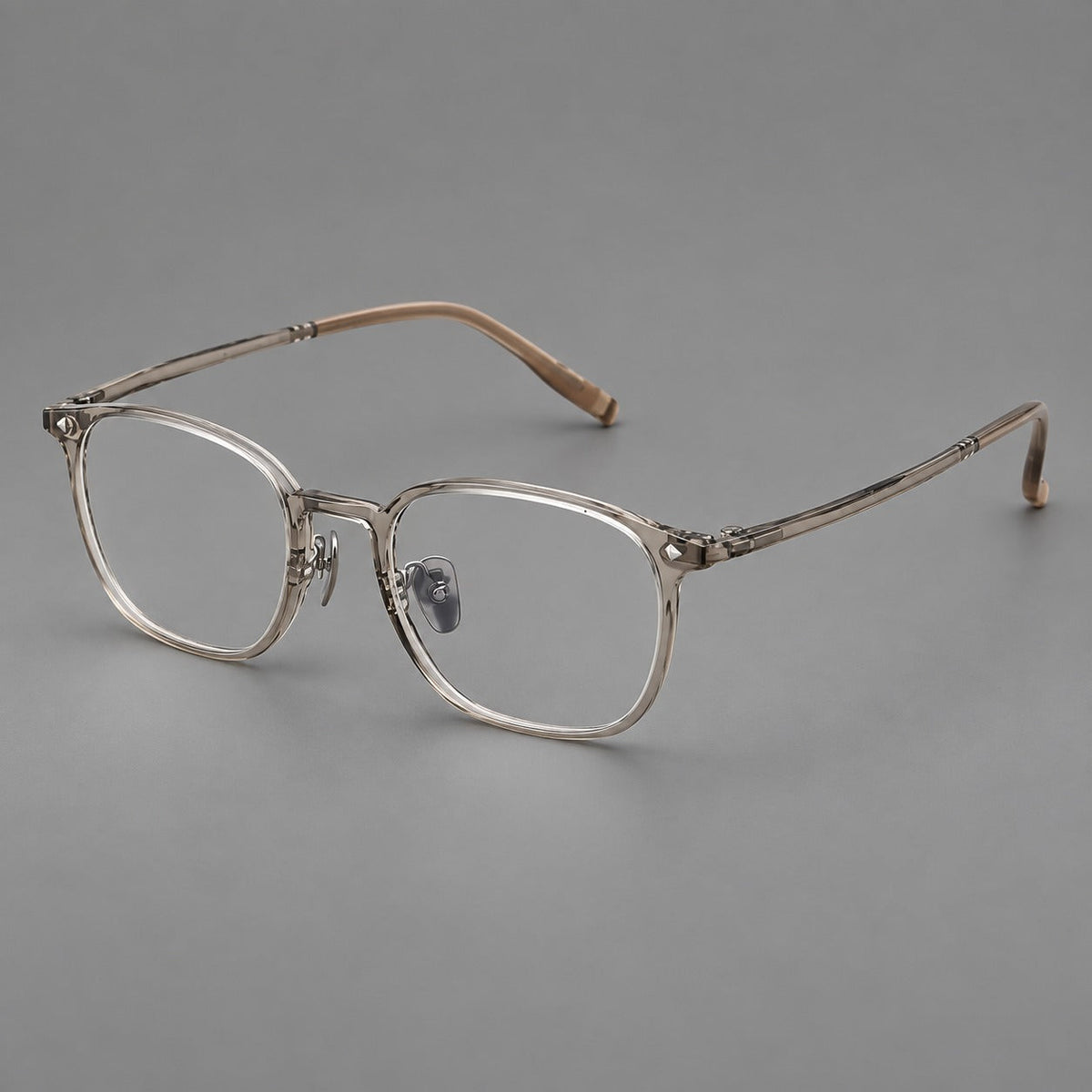 Retro square plastic eyeglasses with a curved bridge and triangular corner details in Gray Tea, three quarter view