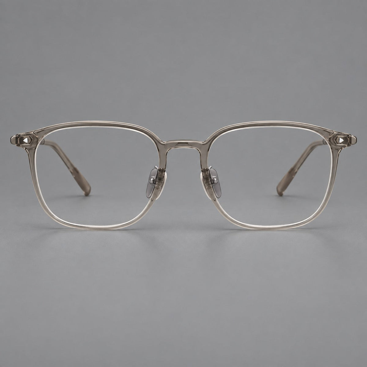 Retro square plastic eyeglasses with a curved bridge and triangular corner details in Gray Tea, front view