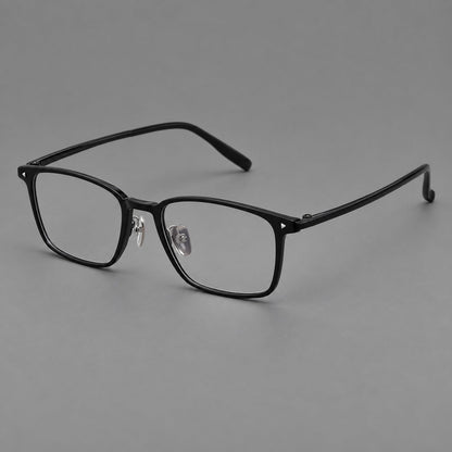 Clean rectangular plastic eyeglasses with flat lower rims and pointed corner details in Glossy Black, three quarter view