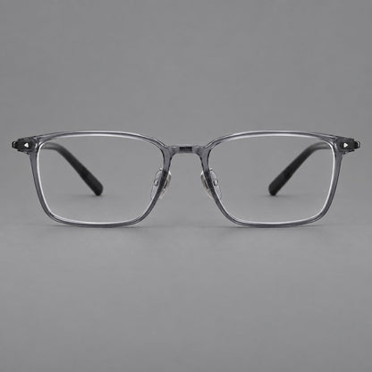 Clean rectangular plastic eyeglasses with flat lower rims and pointed corner details in Ink Gray, front view frame detail