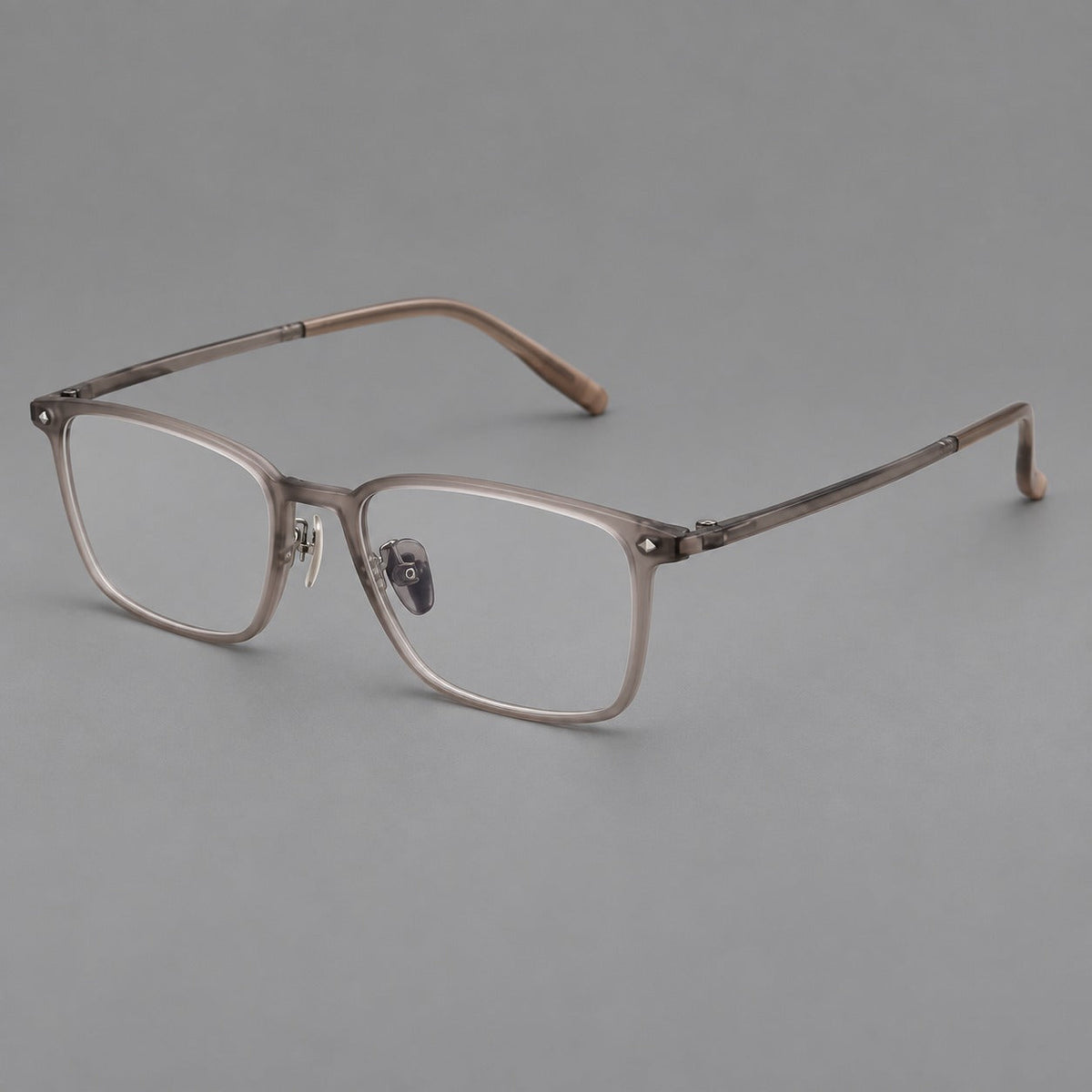 Clean rectangular plastic eyeglasses with flat lower rims and pointed corner details in Matte Tea, three quarter view