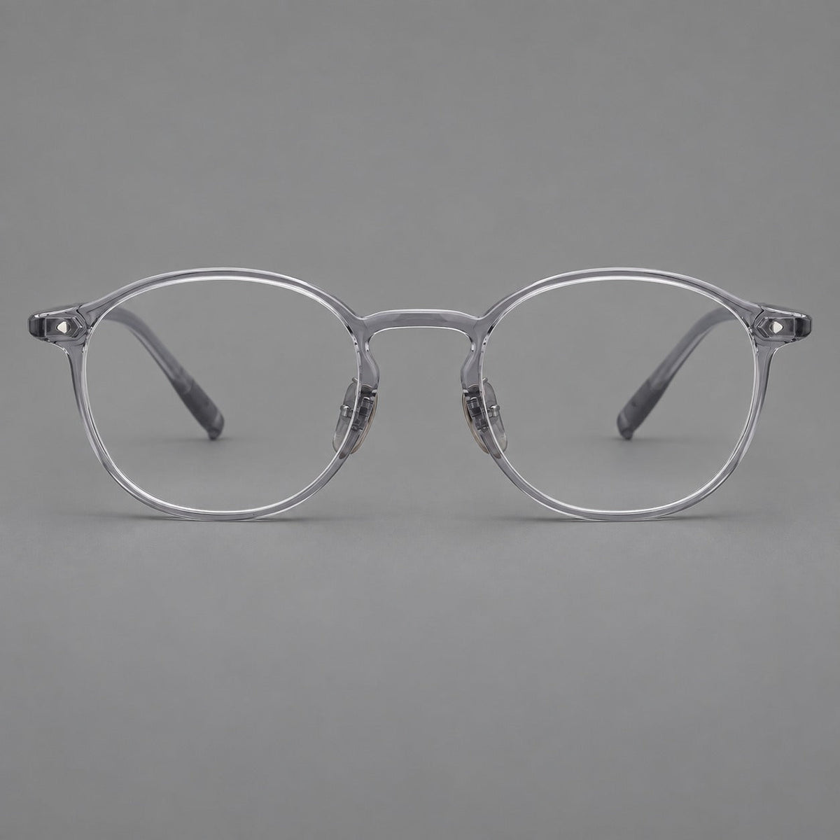 Vintage round plastic eyeglasses with a curved bridge and subtle triangular accents in Light Gray, front view