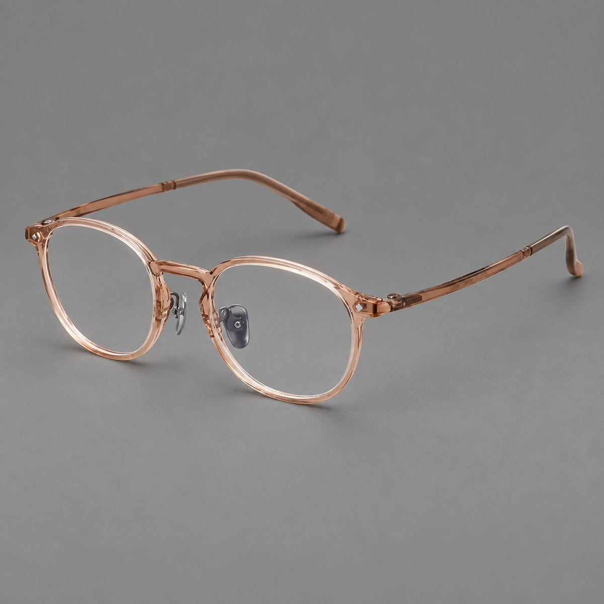 Vintage round plastic eyeglasses with a curved bridge and subtle triangular accents in Tea, three quarter view