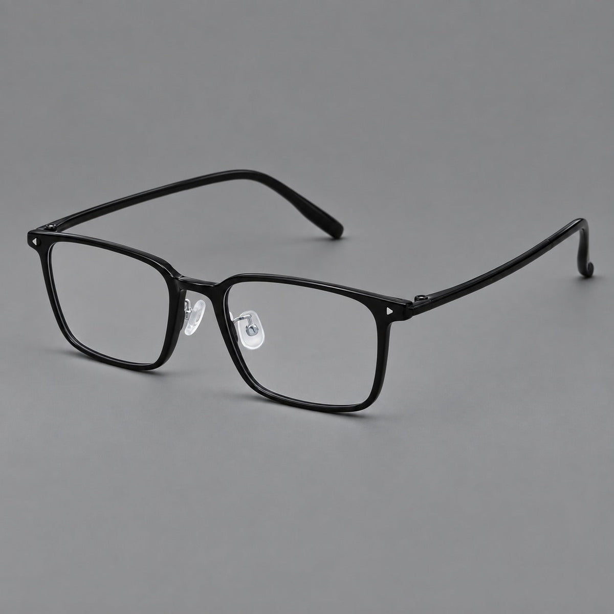 Everyday rectangular plastic eyeglasses with rounded edges and a narrow bridge in Glossy Black, three quarter view