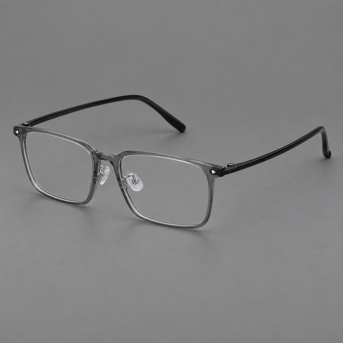 Wide rectangular plastic eyeglasses with an angular browline and slender rims in Medium Gray, three quarter view
