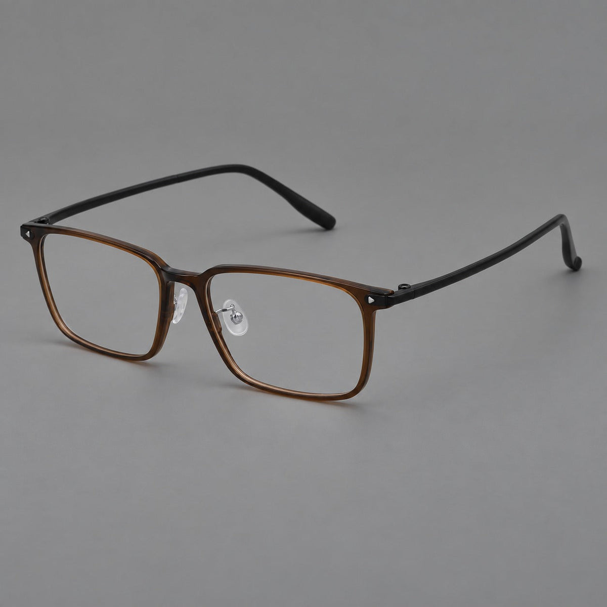 Wide rectangular plastic eyeglasses with an angular browline and slender rims in Tea Brown, three quarter view