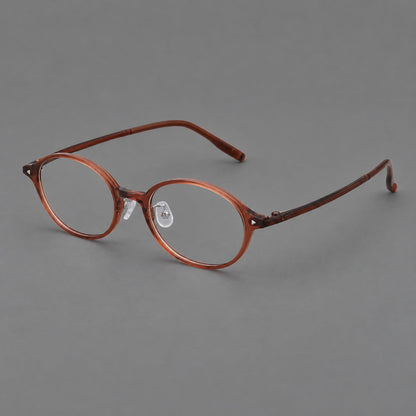 Retro round plastic eyeglasses with softly lifted corners and a sculpted bridge in Brown Red, three quarter view lens detail