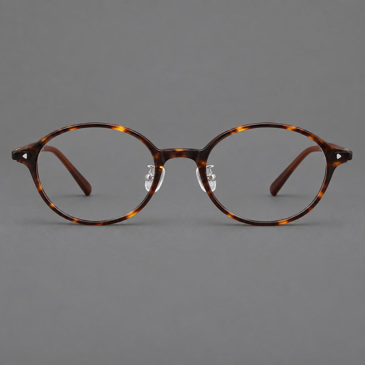 Retro round plastic eyeglasses with softly lifted corners and a sculpted bridge in Tortoiseshell, front view