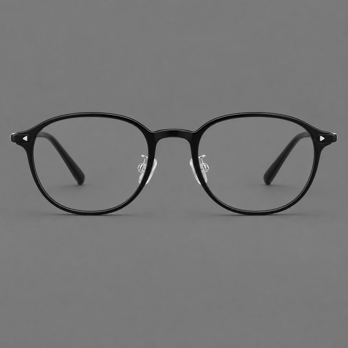 Panto plastic eyeglasses with a rounded silhouette and triangular corner studs in Glossy Black, front view