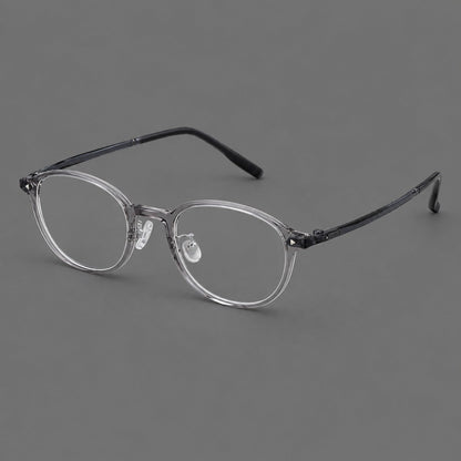 Panto plastic eyeglasses with a rounded silhouette and triangular corner studs in Gray, three quarter view front view