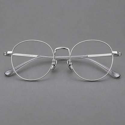 Retro round titanium glasses with a raised bridge and smooth corner shoulders in Silver, front view additional product view