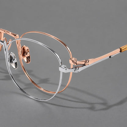 Retro round titanium glasses with a raised bridge and smooth corner shoulders, frame details additional product view