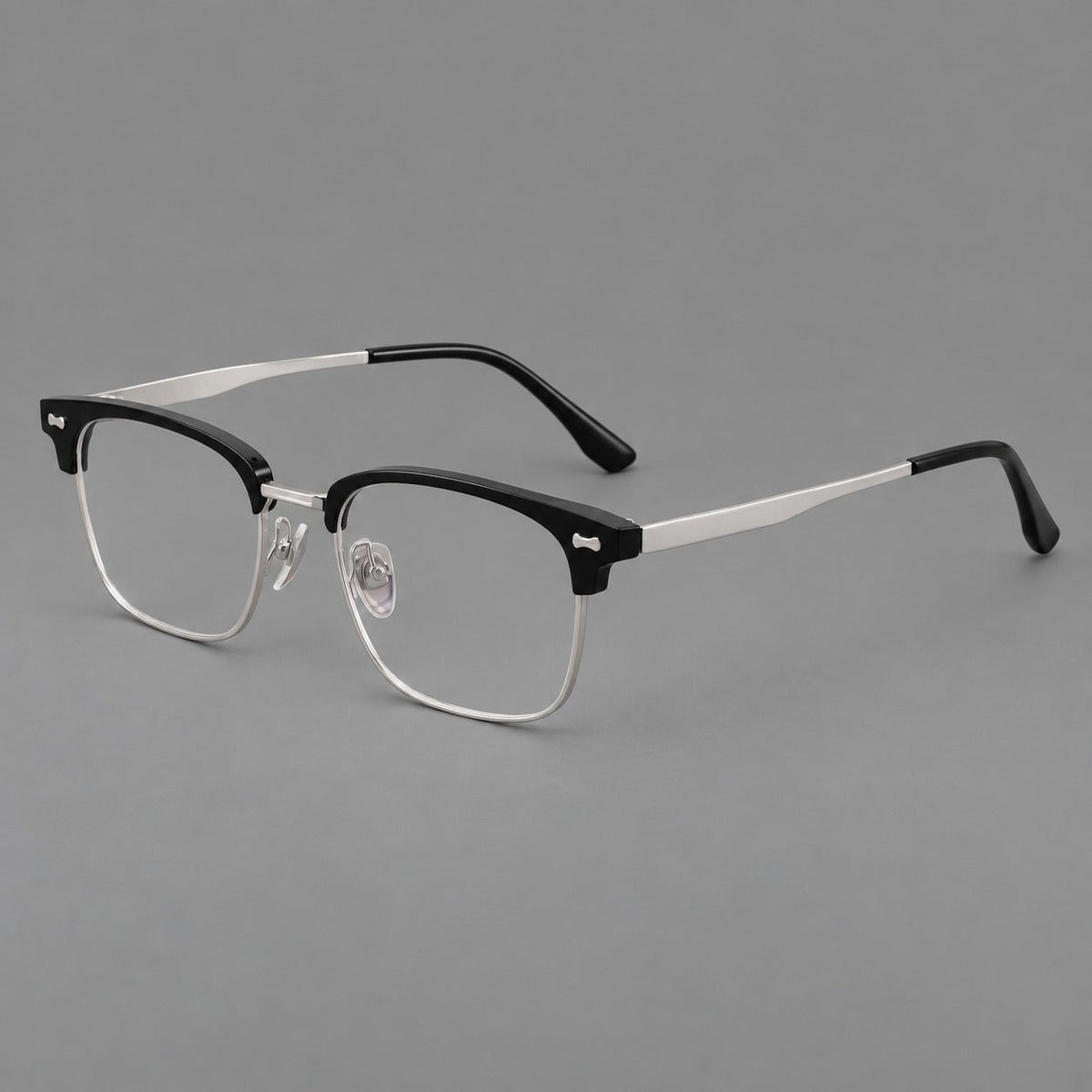 Classic browline titanium glasses with fine lower rims and subtle corner accents in Black and Silver, three quarter view