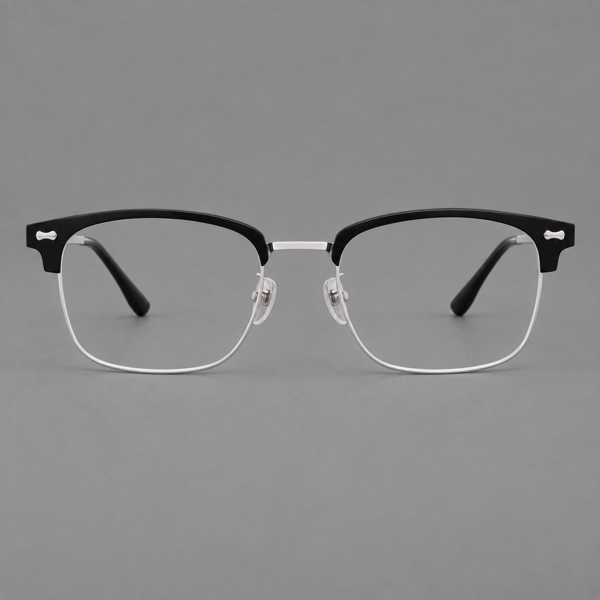 Classic browline titanium glasses with fine lower rims and subtle corner accents in Black and Silver, front view