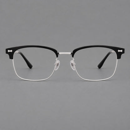 Classic browline titanium glasses with fine lower rims and subtle corner accents in Black and Silver, front view side view