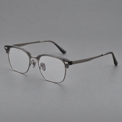 Classic browline titanium glasses with fine lower rims and subtle corner accents in Gunmetal, three quarter view front view