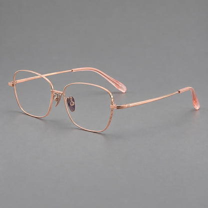 Soft square titanium glasses with angled upper corners and decorated hinges in Rose Gold, three quarter view additional product view