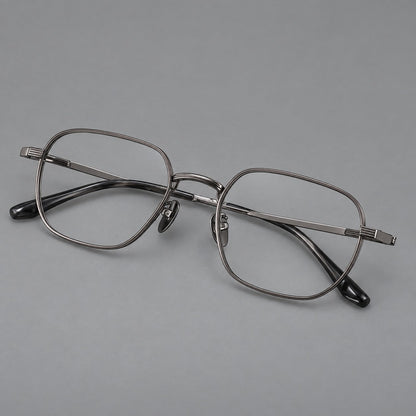 Retro square titanium glasses with rounded rims and finely grooved shoulders in Gunmetal, three quarter view