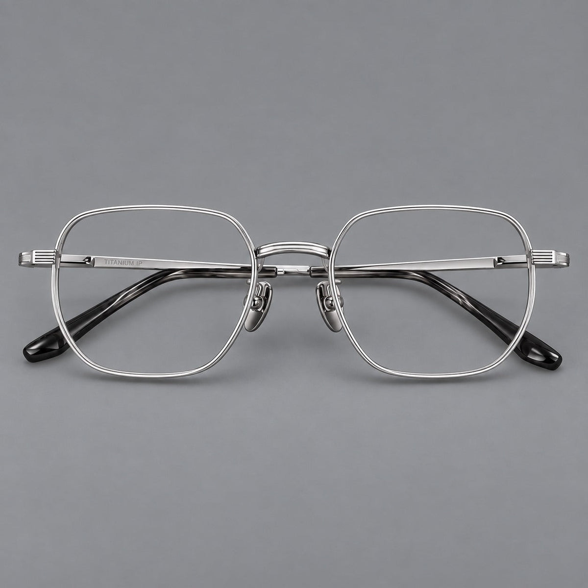 Retro square titanium glasses with rounded rims and finely grooved shoulders in Silver, front view