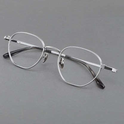 Retro panto titanium glasses with a curved bridge and fine parallel rim grooves in Black and Silver, three quarter view front view