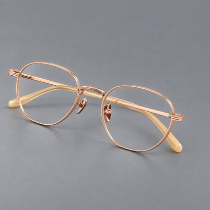 Retro panto titanium glasses with a curved bridge and fine parallel rim grooves in Rose Gold, three quarter view additional product view