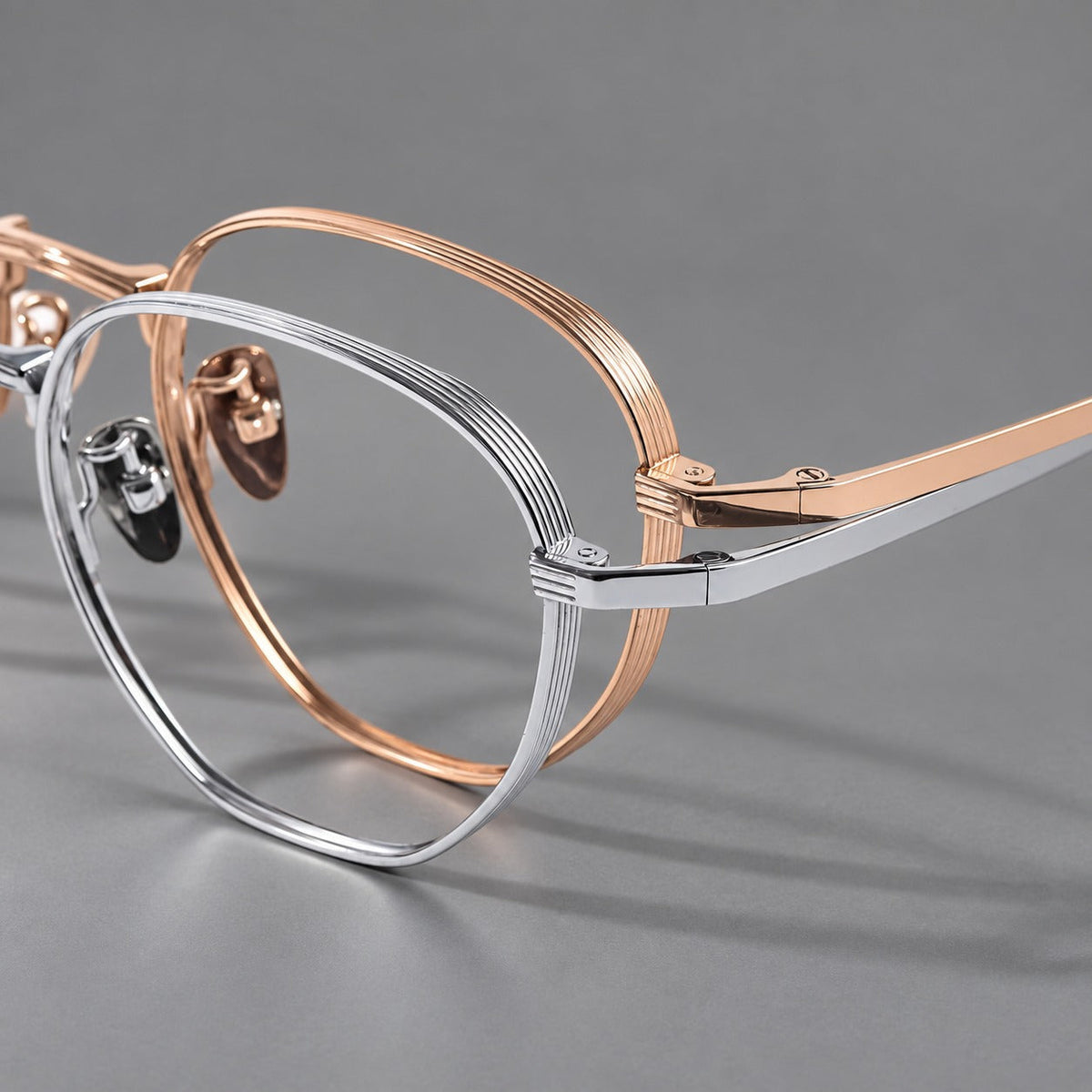 Retro panto titanium glasses with a curved bridge and fine parallel rim grooves, frame details