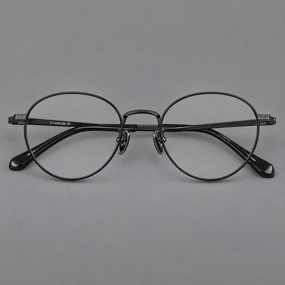 Rounded panto titanium glasses with a raised bridge and dotted temple accents in Black, front view side view