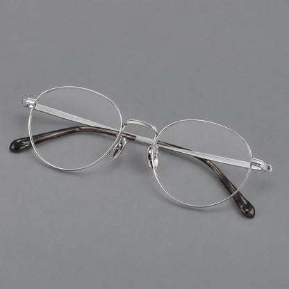 Rounded panto titanium glasses with a raised bridge and dotted temple accents in Silver, three quarter view additional product view