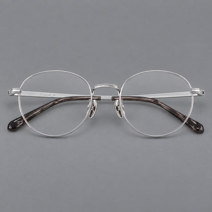 Rounded panto titanium glasses with a raised bridge and dotted temple accents in Silver, front view additional product view