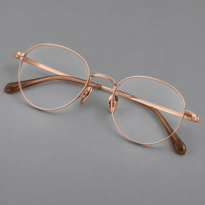 Rounded panto titanium glasses with a raised bridge and dotted temple accents in Rose Gold, three quarter view additional product view
