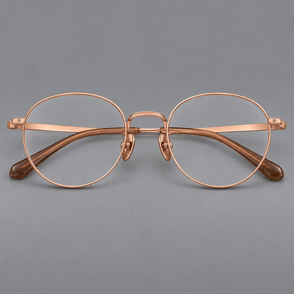 Rounded panto titanium glasses with a raised bridge and dotted temple accents in Rose Gold, front view additional product view