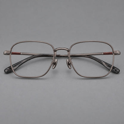 Deep square titanium glasses with a flatter brow and grooved outer shoulders in Gunmetal, front view frame detail