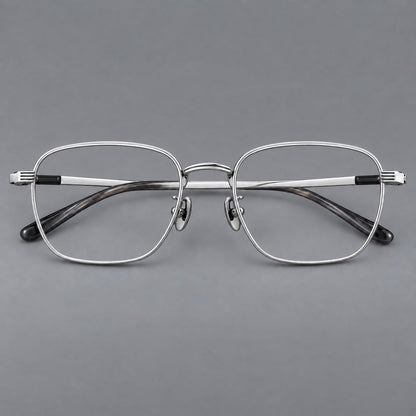 Deep square titanium glasses with a flatter brow and grooved outer shoulders in Black and Silver, front view temple detail