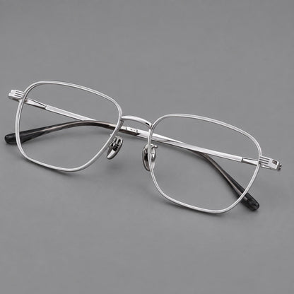 Deep square titanium glasses with a flatter brow and grooved outer shoulders in Silver, three quarter view additional product view