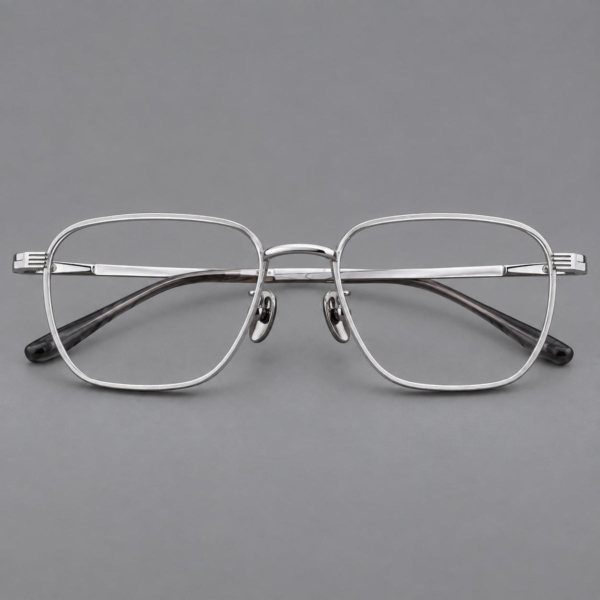 Deep square titanium glasses with a flatter brow and grooved outer shoulders in Silver, front view